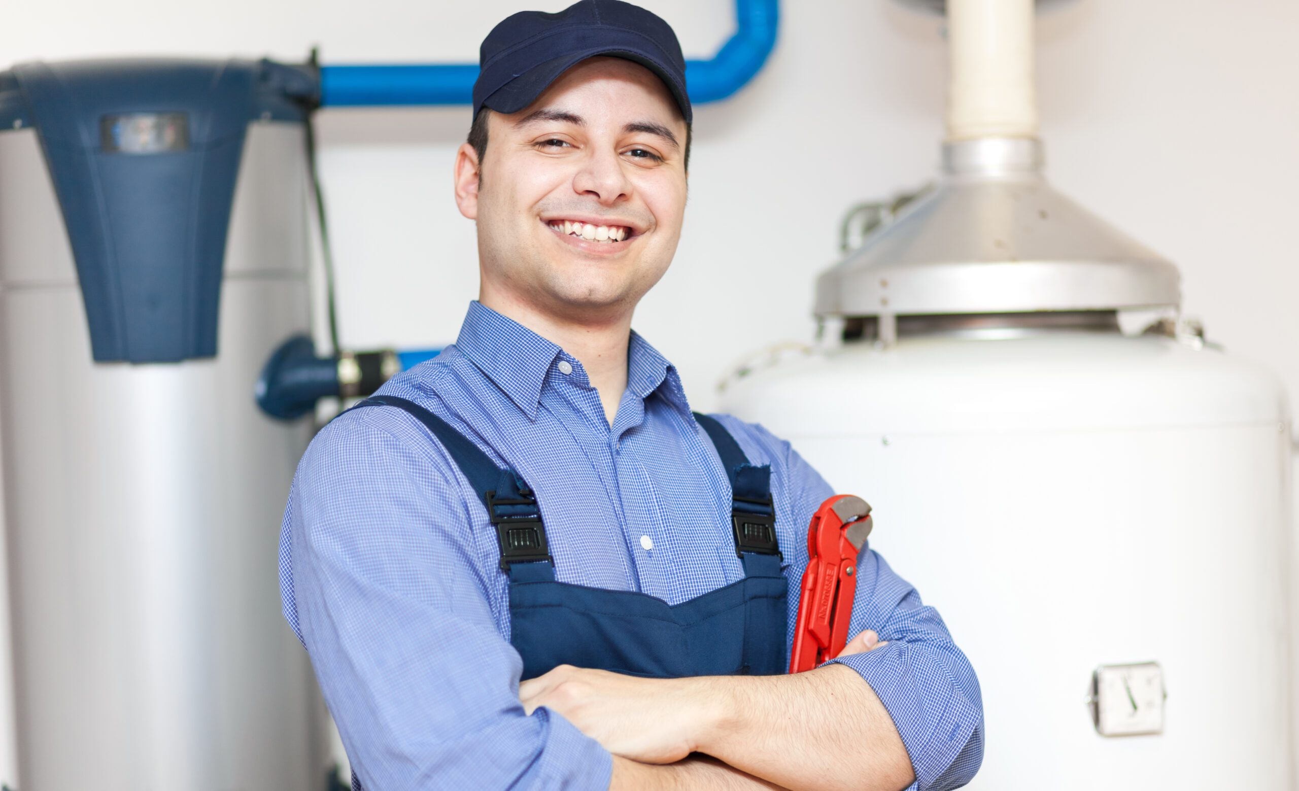 Plumber Repairing an Hot Water Heater Services