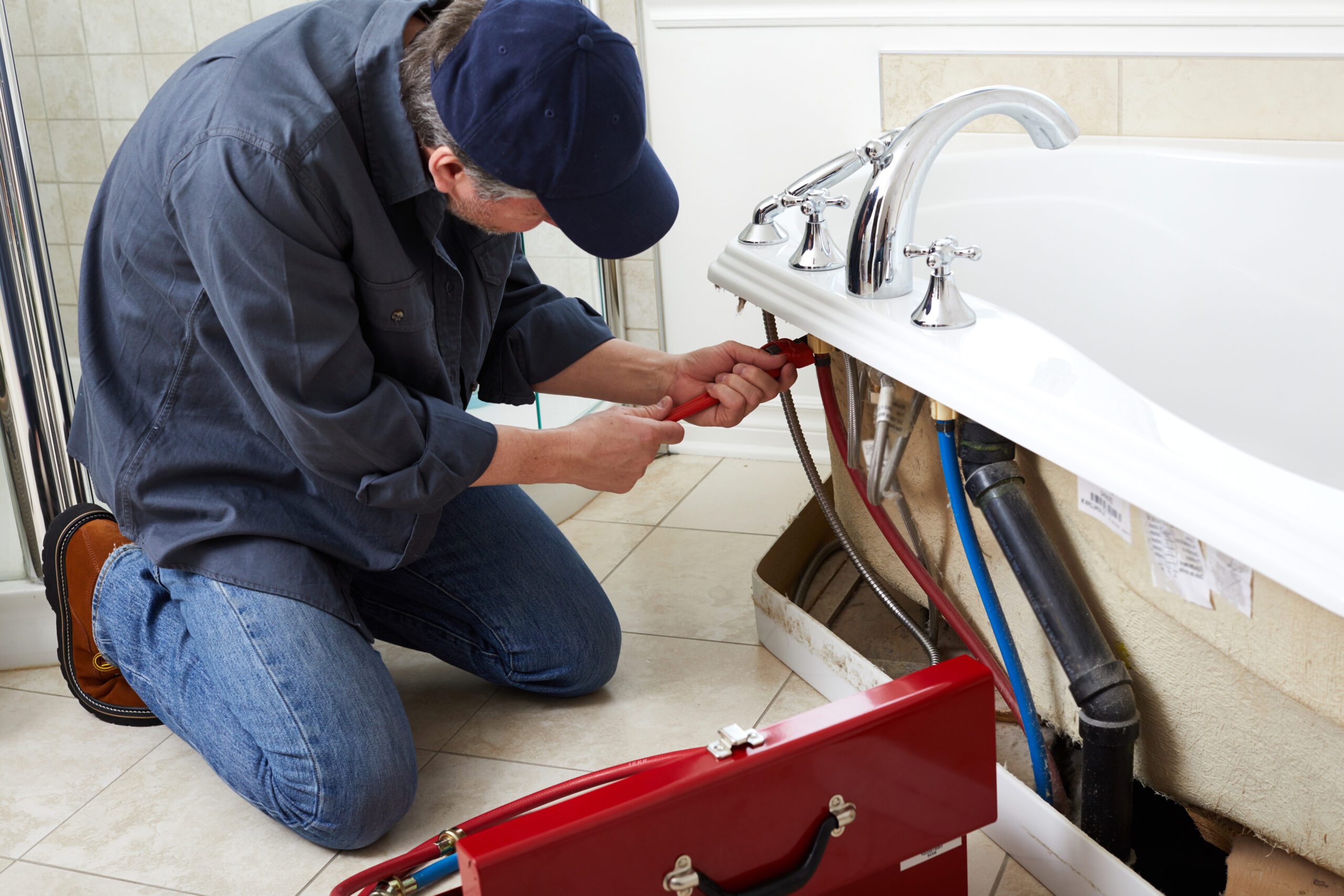 Plumber Repairing Bathroom